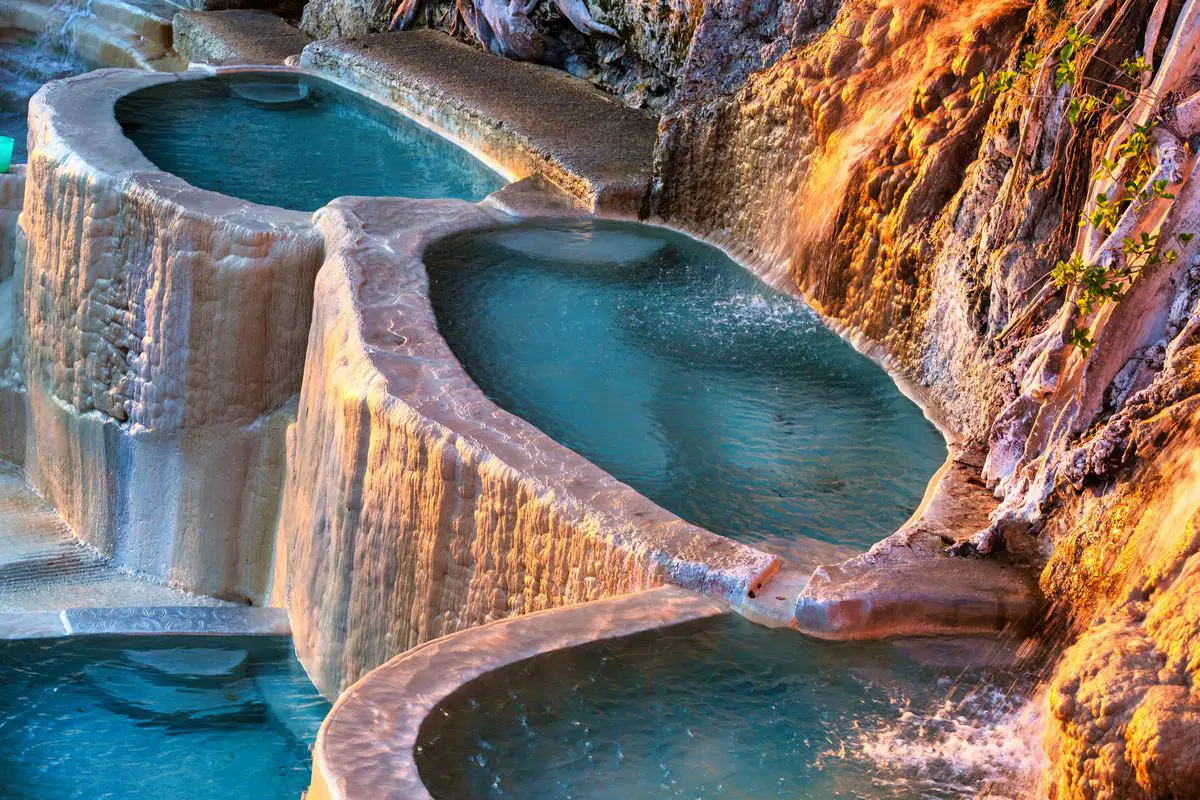 a pool of water in a rocky area - Hot Springs in Arizona
