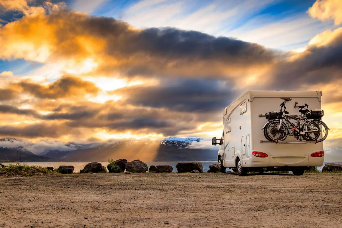 a rv parked in the desert with a bicycle on the back. Free Camping in Quartzsite Arizona